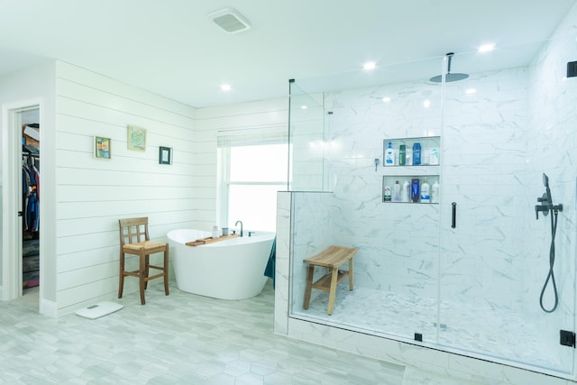 201 Roaring Springs Dr, Joshua, TX 76058 - full bath with a marble finish shower, a freestanding tub, a spacious closet, and recessed lighting