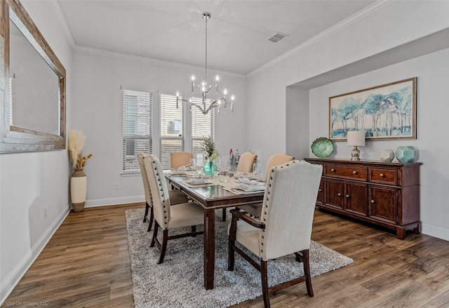 2010 Topaz Dr, Rockwall, TX 75087 - dining space featuring wood finished floors, a chandelier, and ornamental molding