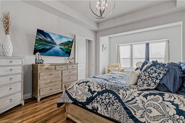 2010 Topaz Dr, Rockwall, TX 75087 - bedroom featuring wood finished floors and a chandelier
