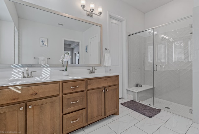 2010 Topaz Dr, Rockwall, TX 75087 - bathroom featuring double vanity, a stall shower, and marble look tile flooring