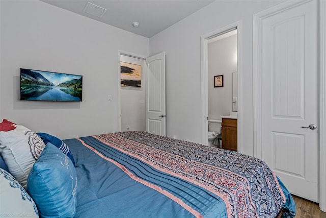 2010 Topaz Dr, Rockwall, TX 75087 - bedroom with wood finished floors and connected bathroom