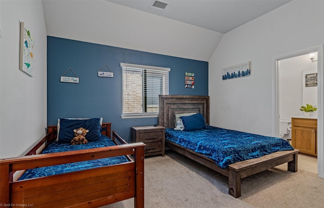 2010 Topaz Dr, Rockwall, TX 75087 - bedroom with lofted ceiling, light colored carpet, and connected bathroom