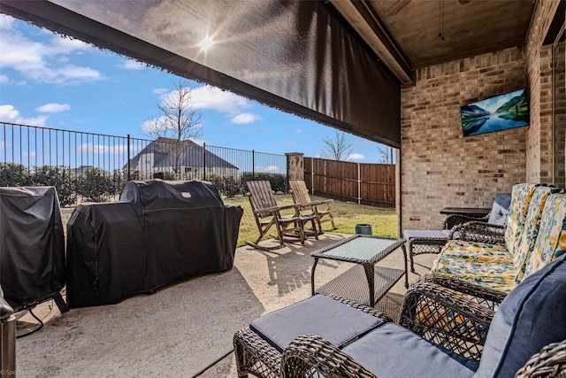 2010 Topaz Dr, Rockwall, TX 75087 - fenced backyard with a patio area, area for grilling, and outdoor lounge area