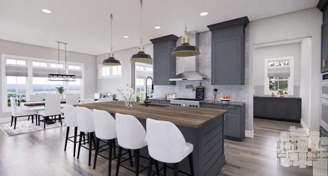 TBDSinclair W Highway 199, Poolville, TX 76487 - kitchen featuring wood counters, wood finished floors, tasteful backsplash, a center island with sink, and a breakfast bar area