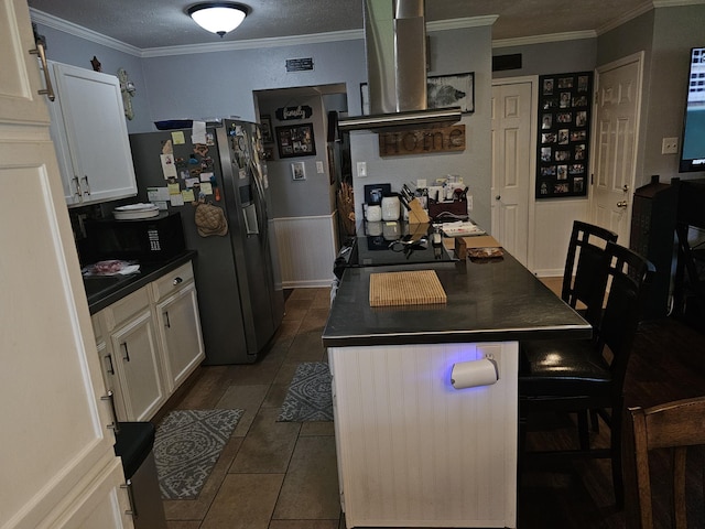 1010 California Trl, Grand Prairie, TX 75052 - kitchen featuring dark countertops, stainless steel fridge, white cabinetry, and ornamental molding