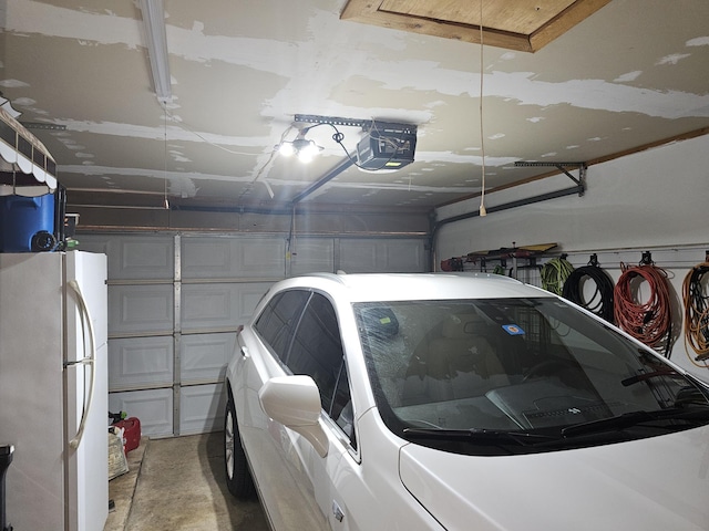 1010 California Trl, Grand Prairie, TX 75052 - garage featuring freestanding refrigerator and a garage door opener