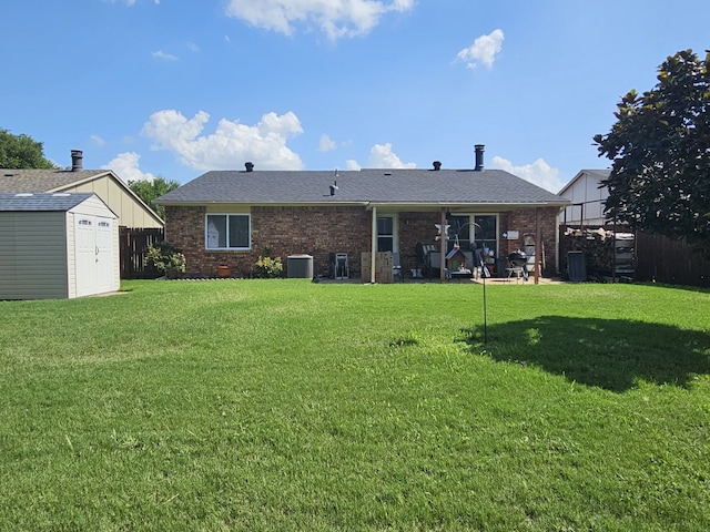 1010 California Trl, Grand Prairie, TX 75052 - rear view of property with a storage shed, brick siding, and roof with shingles
