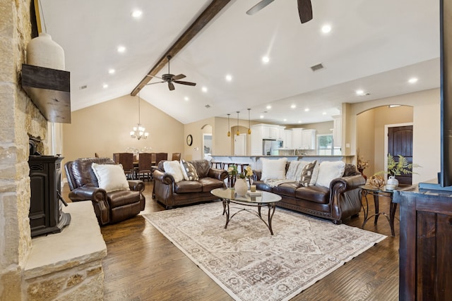 320 Tate Cir, Sherman, TX 75090 - living area featuring a ceiling fan, arched walkways, dark wood-style flooring, and recessed lighting