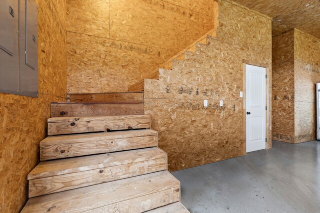 320 Tate Cir, Sherman, TX 75090 - stairs featuring electric panel and concrete flooring
