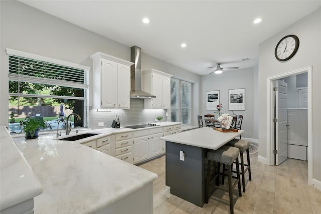 730 Emerald Sound Blvd, Oak Point, TX 75068 - kitchen with wall chimney exhaust hood, white cabinetry, a center island, black electric stovetop, and recessed lighting