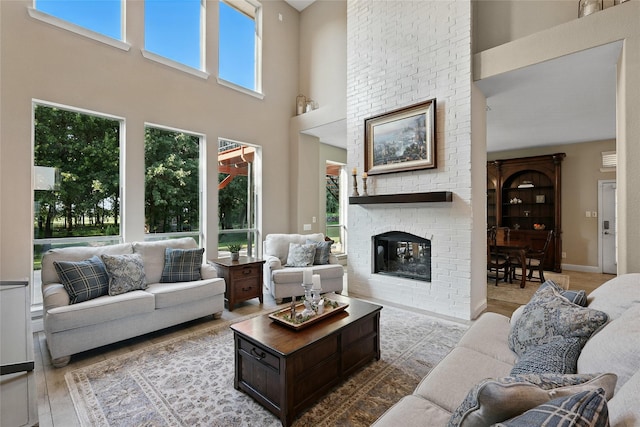 730 Emerald Sound Blvd, Oak Point, TX 75068 - living area featuring a towering ceiling and a fireplace