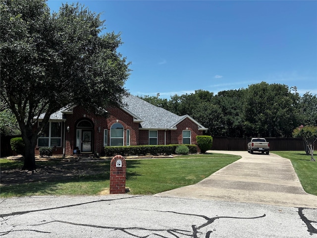 100 Palomino Ct, Shady Shores, TX 76208 - view of front of home featuring brick siding and concrete driveway