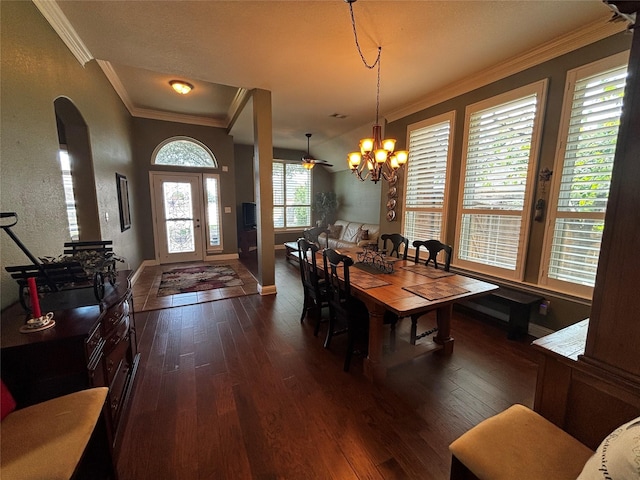 100 Palomino Ct, Shady Shores, TX 76208 - dining space with dark wood-style floors, arched walkways, ornamental molding, and a chandelier