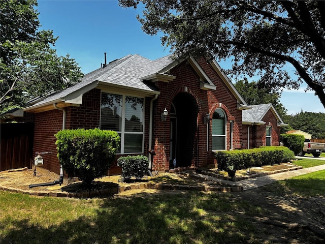 100 Palomino Ct, Shady Shores, TX 76208 - view of front of home featuring brick siding and a shingled roof