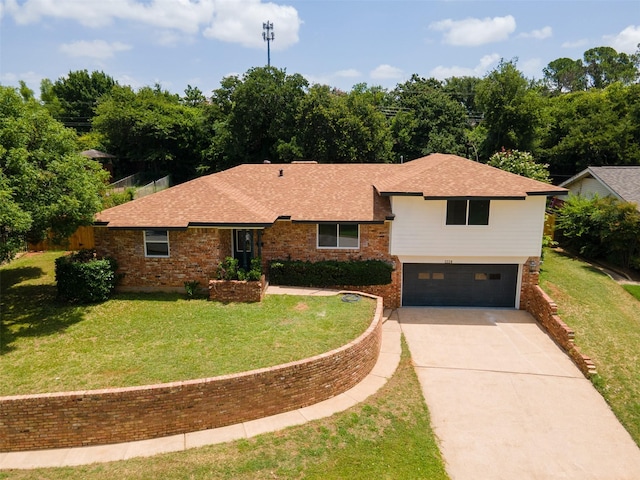 1228 Brookside Dr, Hurst, TX 76053 - tri-level home featuring brick siding, driveway, a shingled roof, and an attached garage