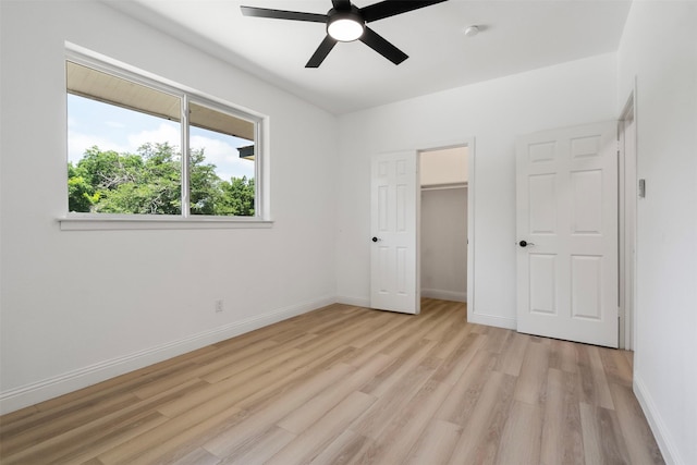 1228 Brookside Dr, Hurst, TX 76053 - unfurnished bedroom featuring light wood-style flooring, a ceiling fan, and a closet