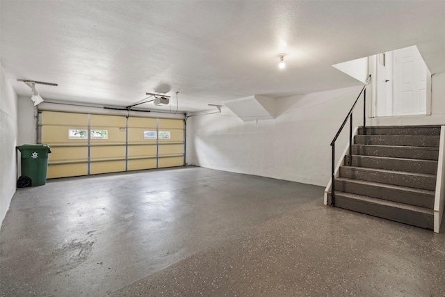 1228 Brookside Dr, Hurst, TX 76053 - garage featuring a garage door opener