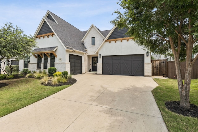3364 Waverly Dr, Celina, TX 75009 - view of front of house with an attached garage, concrete driveway, stucco siding, brick siding, and roof with shingles
