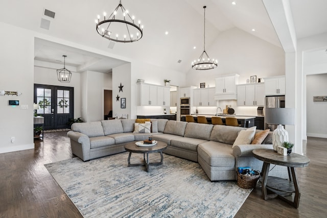 3364 Waverly Dr, Celina, TX 75009 - living room featuring a chandelier, dark wood-style floors, high vaulted ceiling, and recessed lighting