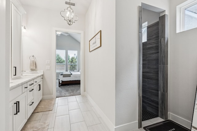 3364 Waverly Dr, Celina, TX 75009 - ensuite bathroom with double vanity, a tile shower, ceiling fan, lofted ceiling, and a chandelier