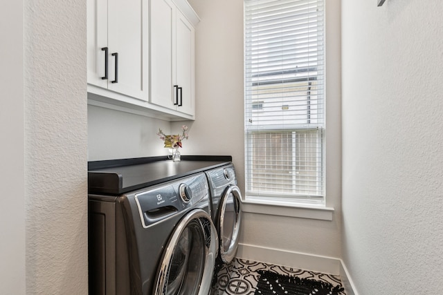 3364 Waverly Dr, Celina, TX 75009 - laundry room featuring cabinet space, washing machine and dryer, healthy amount of natural light, and a textured wall