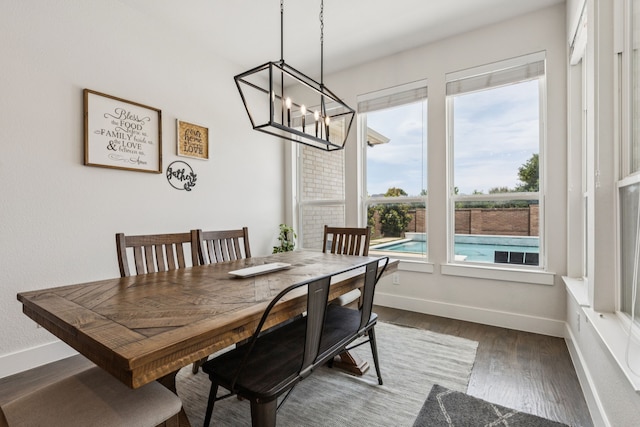 3364 Waverly Dr, Celina, TX 75009 - dining area with a chandelier and dark wood-type flooring