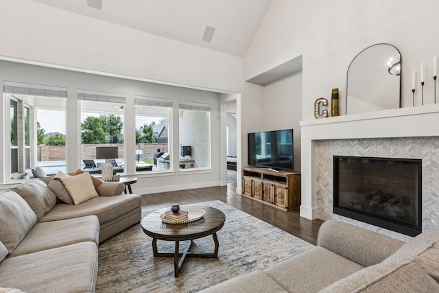 3364 Waverly Dr, Celina, TX 75009 - living area with a glass covered fireplace, high vaulted ceiling, and wood finished floors