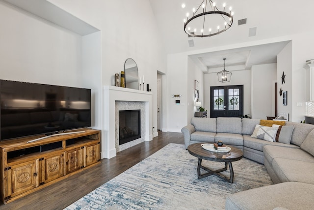 3364 Waverly Dr, Celina, TX 75009 - living room featuring a chandelier, wood finished floors, a fireplace, and high vaulted ceiling