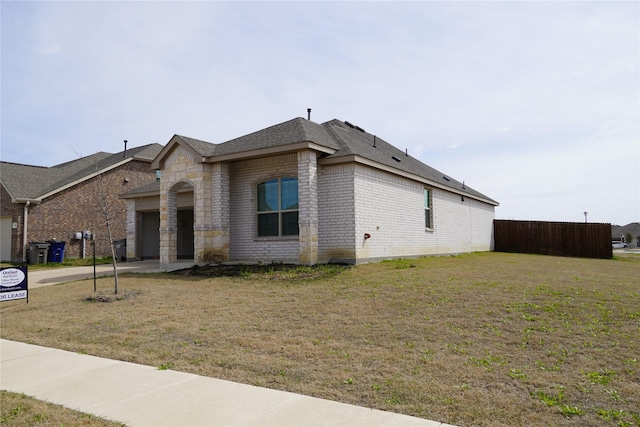 423 Pepperbark Ave, Princeton, TX 75407 - view of property exterior featuring brick siding, an attached garage, stone siding, and roof with shingles