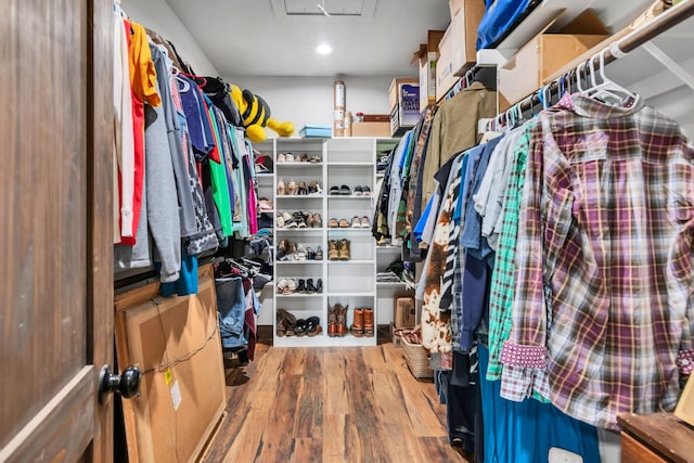 234 Pumphrey Rd, Loving, TX 76460 - walk in closet with wood finished floors and attic access