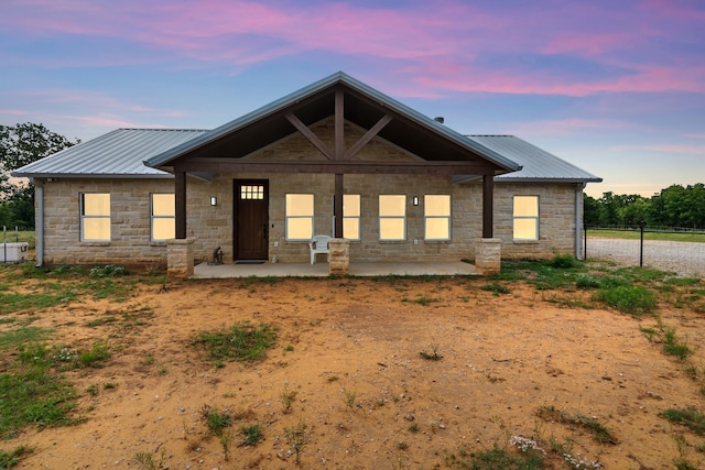 234 Pumphrey Rd, Loving, TX 76460 - view of front of property featuring stone siding and a metal roof