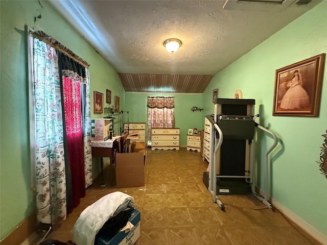 7032 Wofford Ave, Dallas, TX 75227 - bedroom with lofted ceiling and a textured ceiling