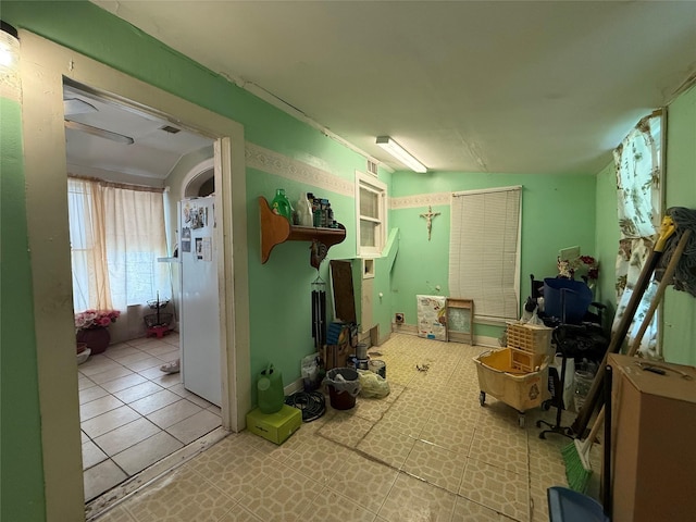 7032 Wofford Ave, Dallas, TX 75227 - basement featuring freestanding refrigerator