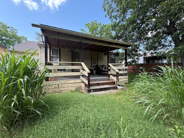 7032 Wofford Ave, Dallas, TX 75227 - rear view of house with covered porch