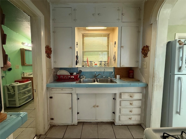 7032 Wofford Ave, Dallas, TX 75227 - bathroom with tile patterned flooring and vanity