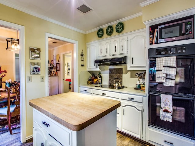 7204 Canongate Dr, Dallas, TX 75248 - kitchen with black appliances, white cabinetry, butcher block countertops, a kitchen island, and crown molding