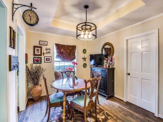 7204 Canongate Dr, Dallas, TX 75248 - dining room with a raised ceiling, a chandelier, dark wood-style floors, and ornamental molding