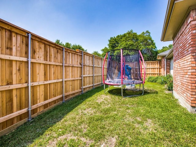 7204 Canongate Dr, Dallas, TX 75248 - fenced backyard featuring a trampoline