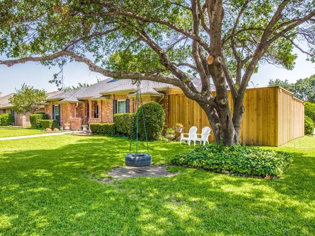 7204 Canongate Dr, Dallas, TX 75248 - ranch-style house featuring a front yard and brick siding