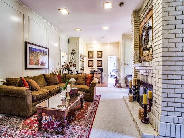 7204 Canongate Dr, Dallas, TX 75248 - carpeted living room featuring a brick fireplace, a decorative wall, and crown molding