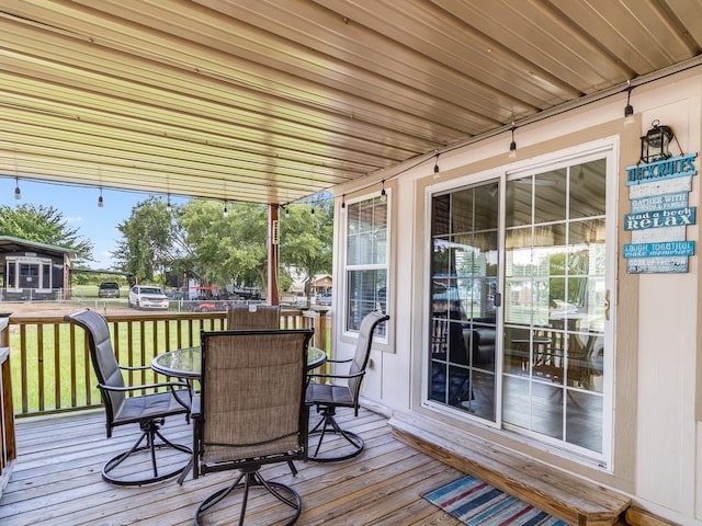 1045 Pelican Isle Dr, Kerens, TX 75144 - wooden deck with outdoor dining area and a lawn
