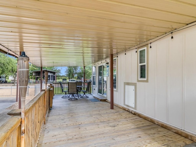 1045 Pelican Isle Dr, Kerens, TX 75144 - wooden terrace with outdoor dining area