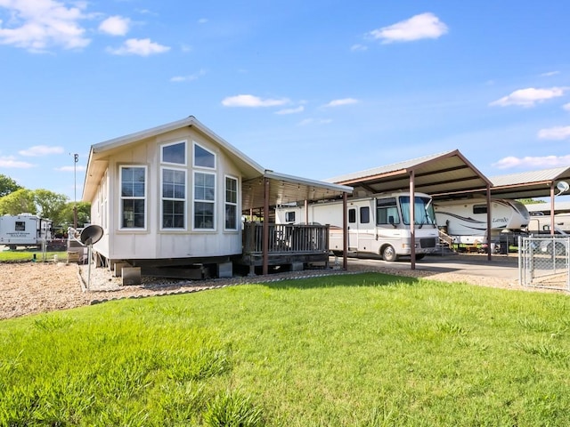 1045 Pelican Isle Dr, Kerens, TX 75144 - back of property featuring a detached carport and a yard