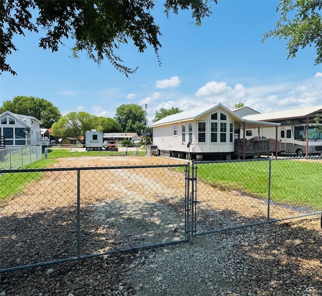 1045 Pelican Isle Dr, Kerens, TX 75144 - rear view of house featuring a gate