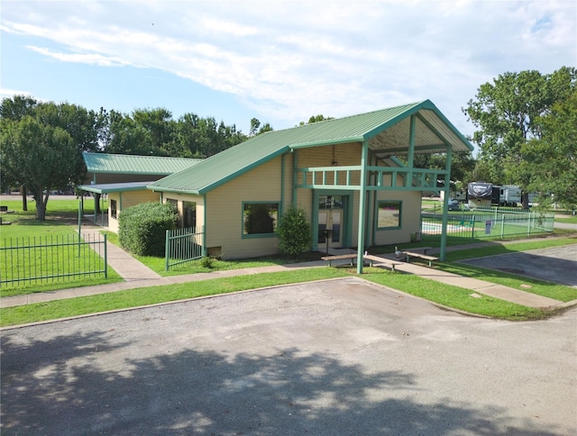 1045 Pelican Isle Dr, Kerens, TX 75144 - view of front of house featuring a metal roof and french doors