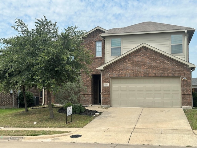1206 Erika, Forney, TX 75126 - view of front facade with concrete driveway, brick siding, and a garage