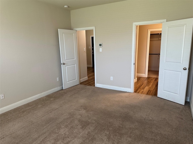 1206 Erika, Forney, TX 75126 - unfurnished bedroom featuring carpet floors and a walk in closet