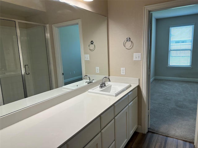1206 Erika, Forney, TX 75126 - bathroom with a stall shower, vanity, and wood finished floors