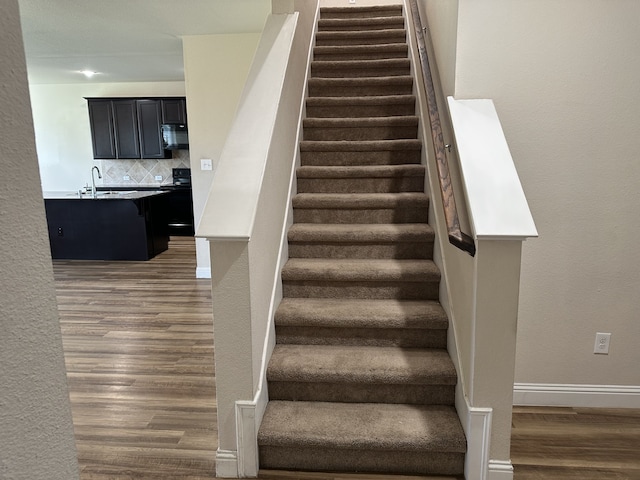 1206 Erika, Forney, TX 75126 - stairway with wood finished floors and baseboards