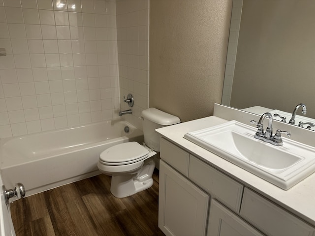 1206 Erika, Forney, TX 75126 - bathroom featuring wood finished floors, vanity,  shower combination, and a textured wall